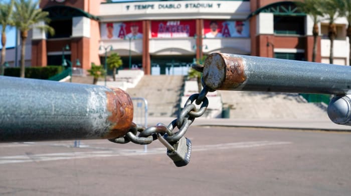 The main parking lot at the Los Angeles Angels Tempe Diablo Stadium remains closed as pitchers and catchers are not starting spring training workouts as scheduled as the Major League Baseball lockout enters its 77th day and will prevent pitchers and catchers from taking the field for the first time since October in Tempe, Ariz., Wednesday, Feb. 16, 2022.